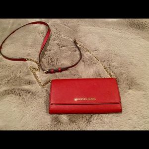 EUC Michael Kors wallet with removable strap. Minor blemish under left snap.